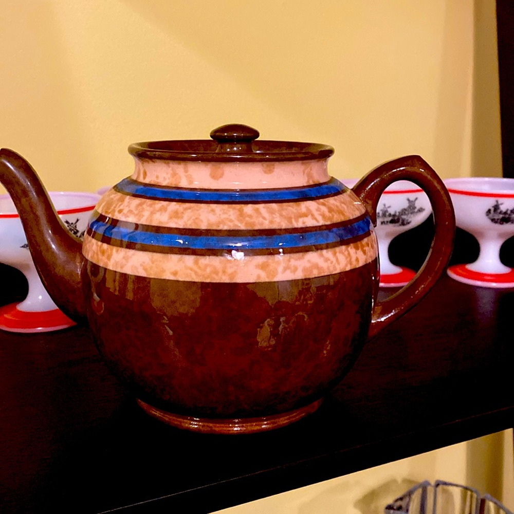 Sadler teapot made in England. Blue, cream, Brown glaze on red clay. Few dings.